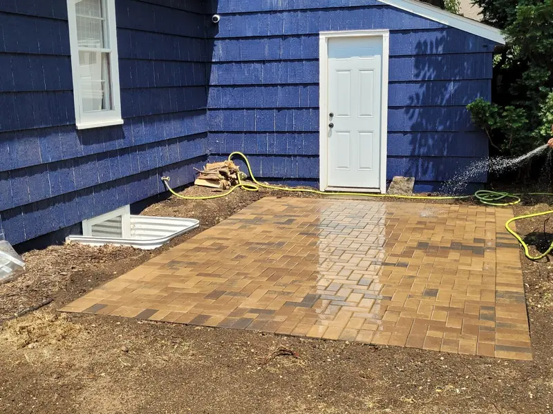 A staggered brick paver patio built by Green Dynamics